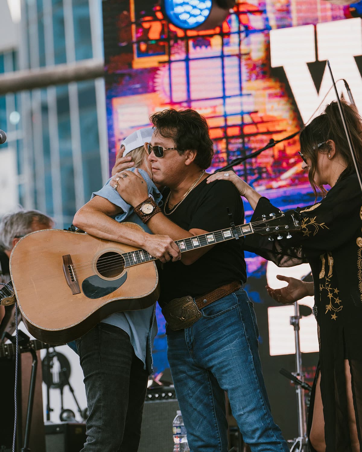 Sho-Bud's Dawn Jackson and Robert's Western World owner JesseLee Jones embrace at Fan Fair August 2025 in Nashville